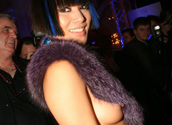 Here is Bai Ling in some blue piece of fuzz with a strap