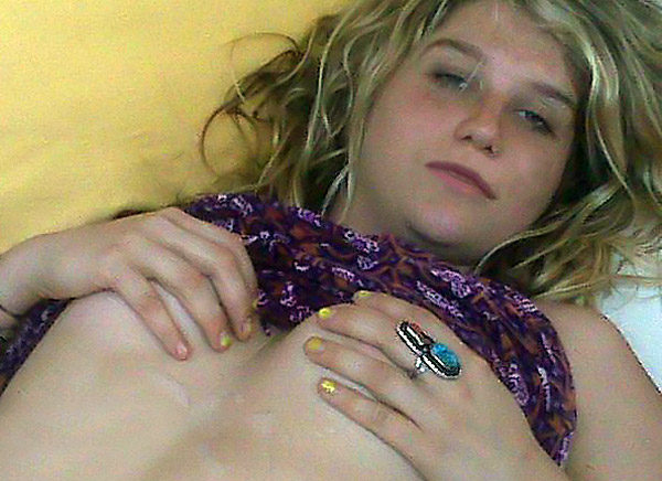 Here is stolen pic of Kesha topless holding her tits and supposedly covered