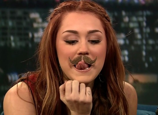 Last night Miley Cyrus wore a fake moustache and makes some sexy faces and Last night Miley Cyrus wore a fake moustache and makes some sexy faces and