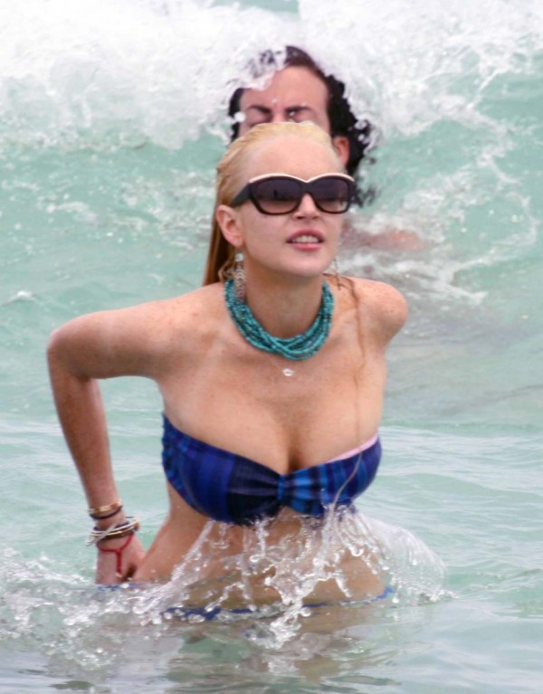 Lindsay Lohan oops boob slip in a bikini