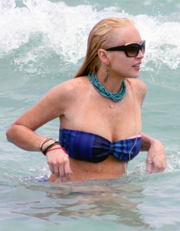 Lindsay Lohan oops boob slip in a bikini Lindsay Lohan oops boob slip in a bikini