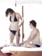 Milla Jovovich topless bikini