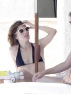 Milla Jovovich topless bikini