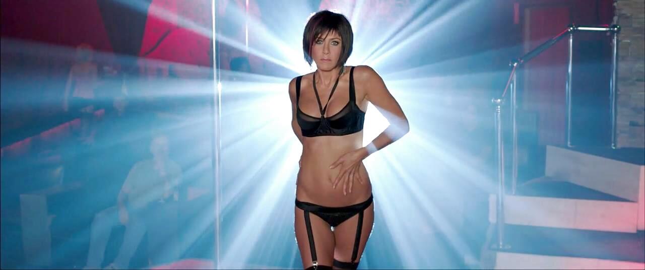 Jennifer Aniston as Rose on the strip-club stage in a black bra and garter belt, We're the Millers (2013)