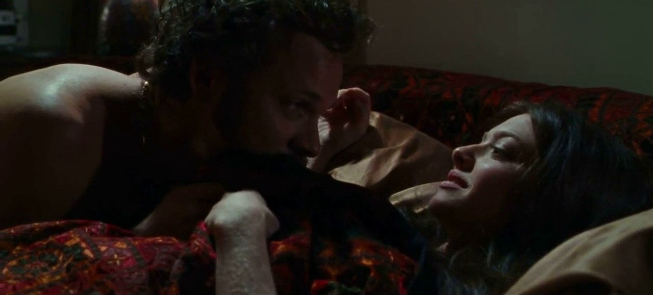 Linda and Chuck in bed early in the relationship, Lovelace