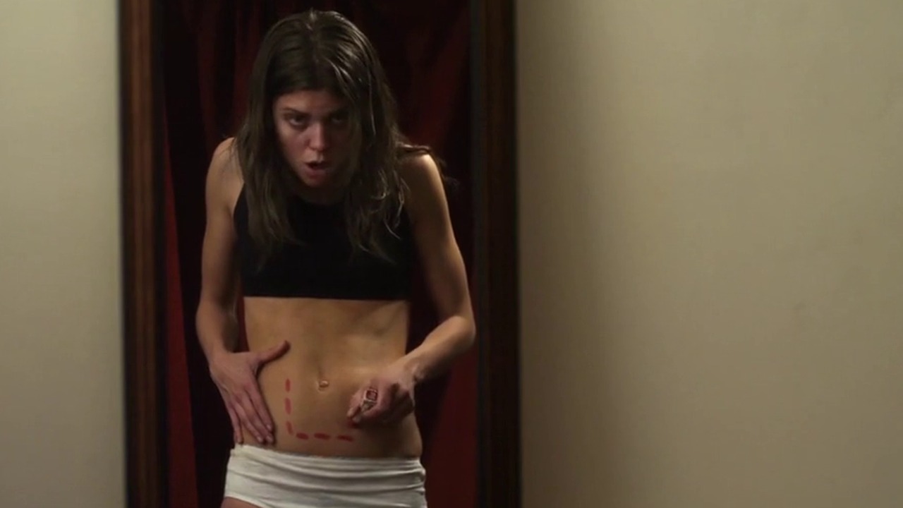 AnnaLynne McCord as Pauline in a doorway in Excision (2012)