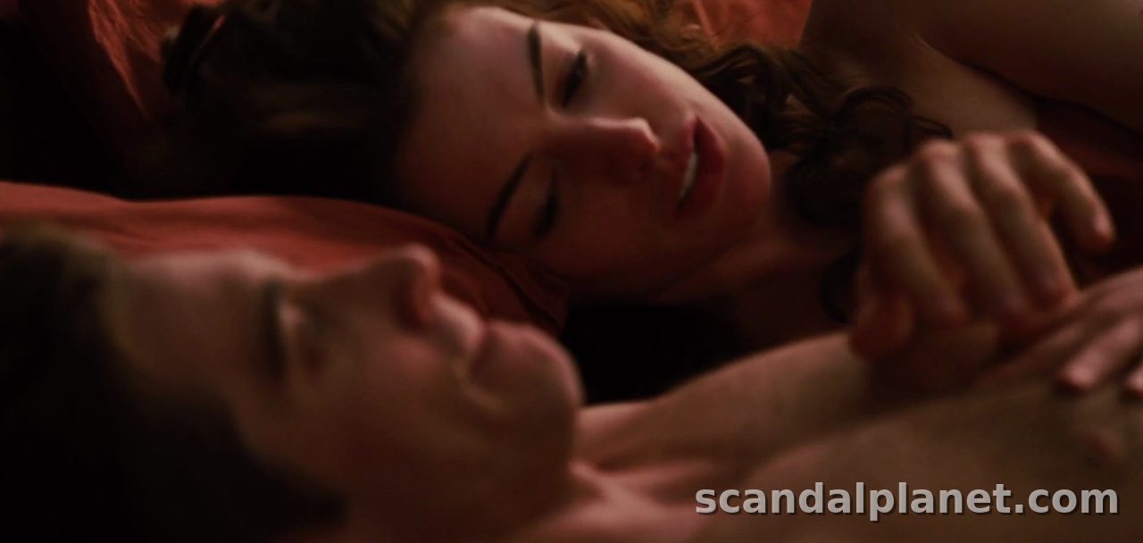 Anne Hathaway lying back on red sheets, Love & Other Drugs