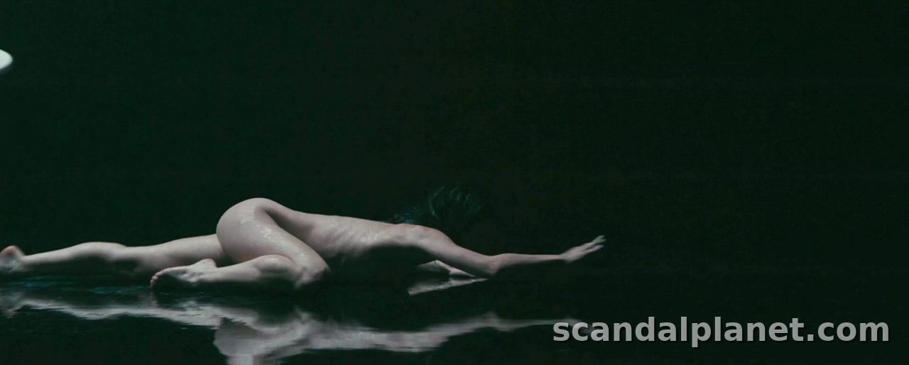 Anne Hathaway crawling across a dark floor, Mother Mary