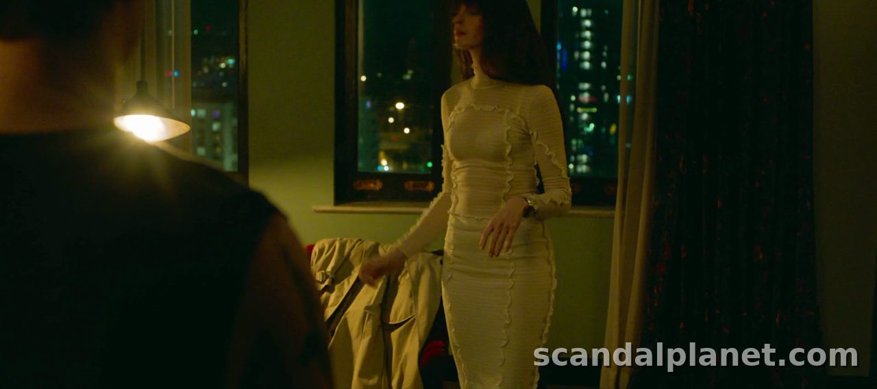 Anne Hathaway in a cream dress by the hotel window, The Idea of You (2024)