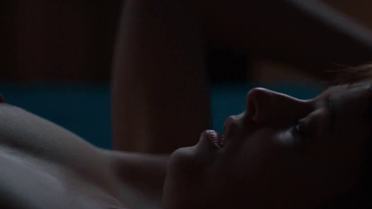 Dakota Johnson on the bed in the Fifty Shades of Grey first time scene
