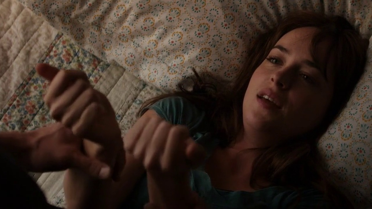Dakota Johnson as Anastasia Steele on the bed, Fifty Shades of Grey (2015)