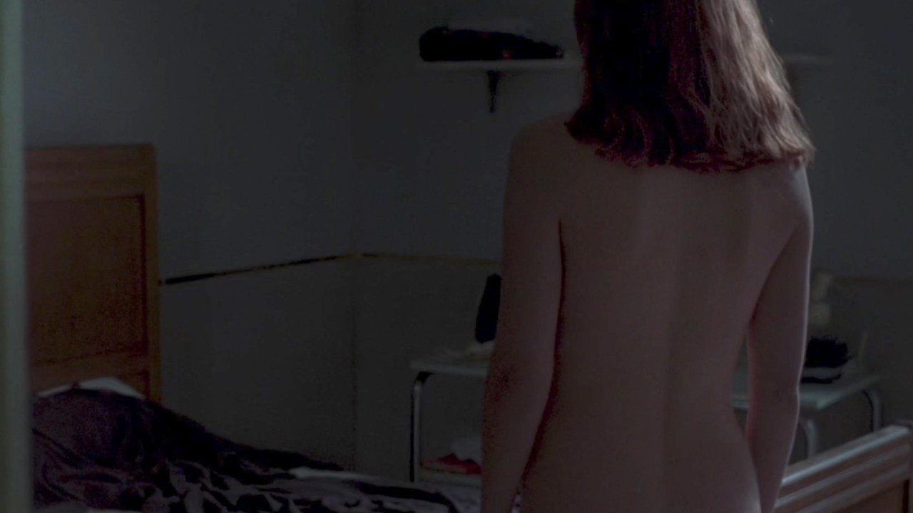 Dakota Johnson as Susie Bannion in her dorm room, Suspiria (2018)