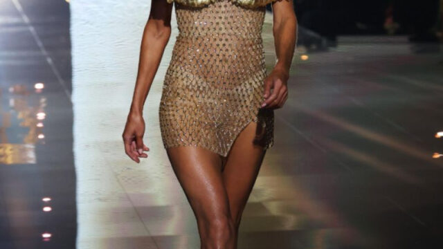 Doutzen Kroes in gold wings and a sheer gold mini dress on the Victoria's Secret Fashion Show 2025 runway