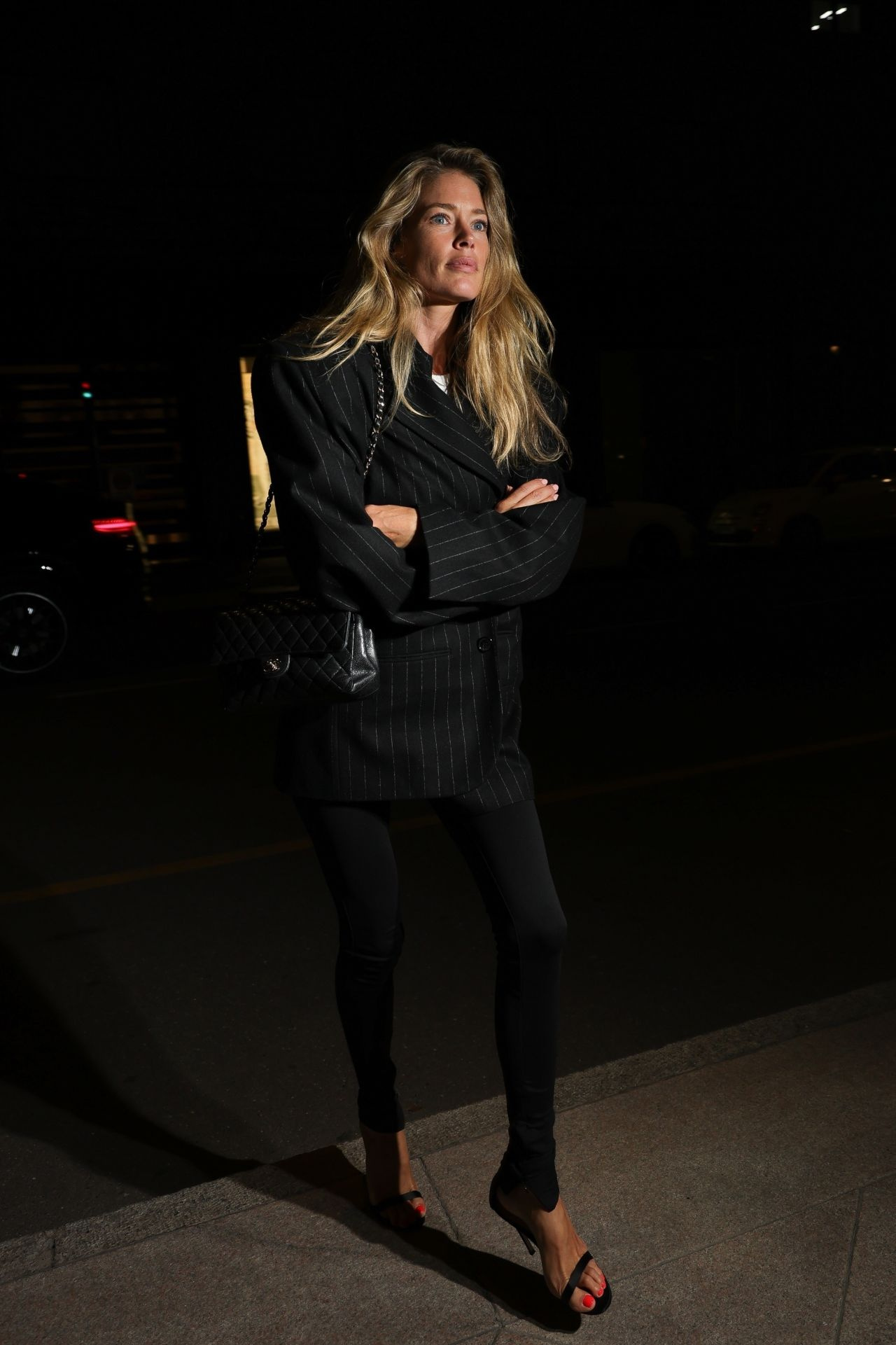 Doutzen Kroes full-length in an elegant evening look after Milan Fashion Week, September 2024