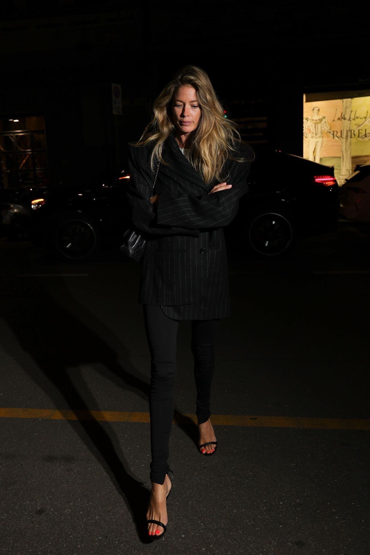 Doutzen Kroes smiling in an elegant ensemble after Milan Fashion Week, September 2024