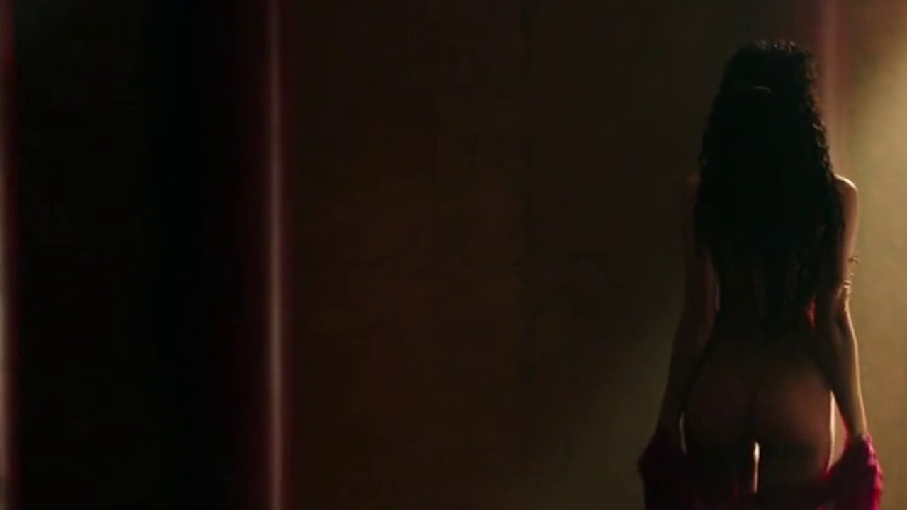 Irina Shayk as Megara in silhouette, back to the camera, in the undressing scene from Hercules (2014)