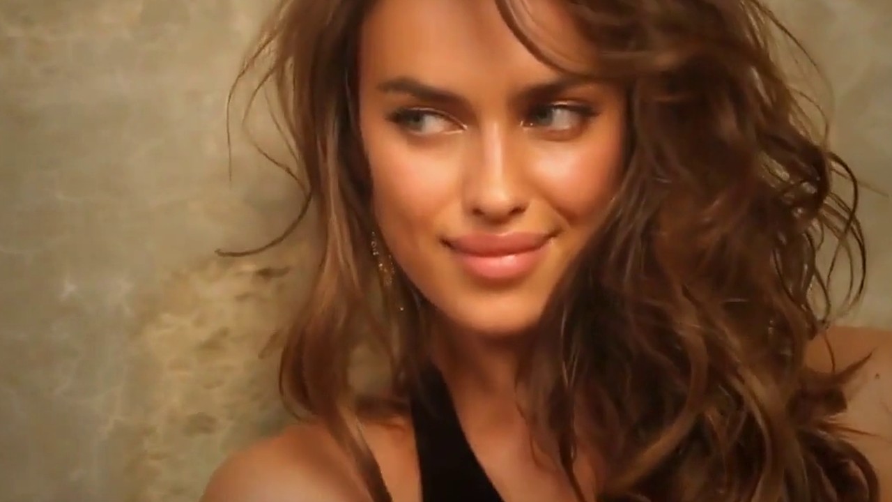 Irina Shayk smiling in a close-up from the Sports Illustrated Swimsuit 2013 video