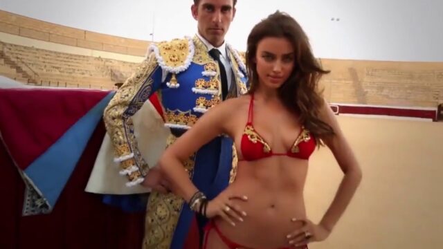 Irina Shayk in a red bikini beside a matador in the Sports Illustrated Swimsuit 2013 video