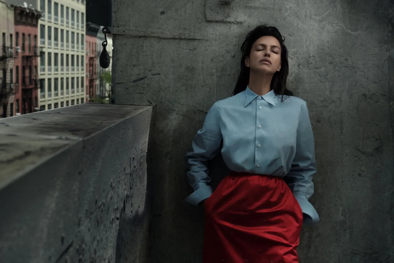 Irina Shayk in black Prada three-piece tailoring with necktie for Vogue Arabia October 2026