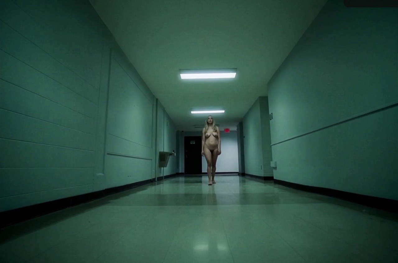 Jennifer Lawrence as Grace in a white corridor, Die My Love (2025)