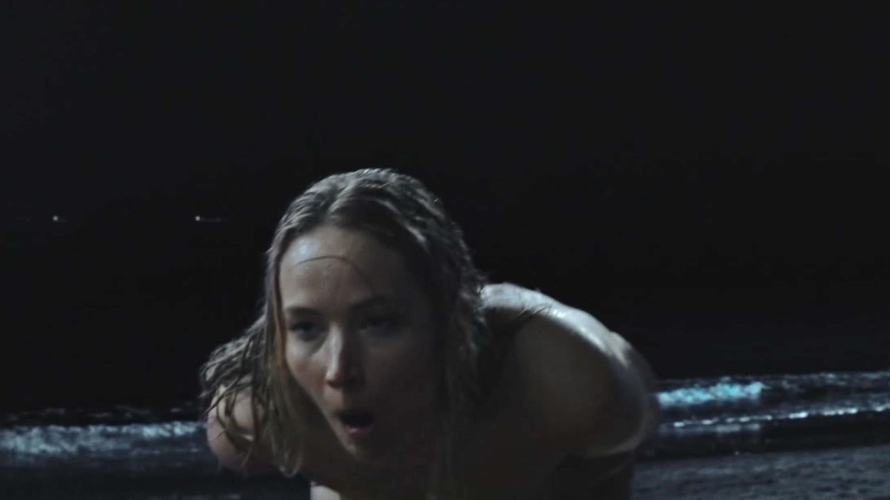 Jennifer Lawrence crawling out of the surf in the No Hard Feelings beach scene