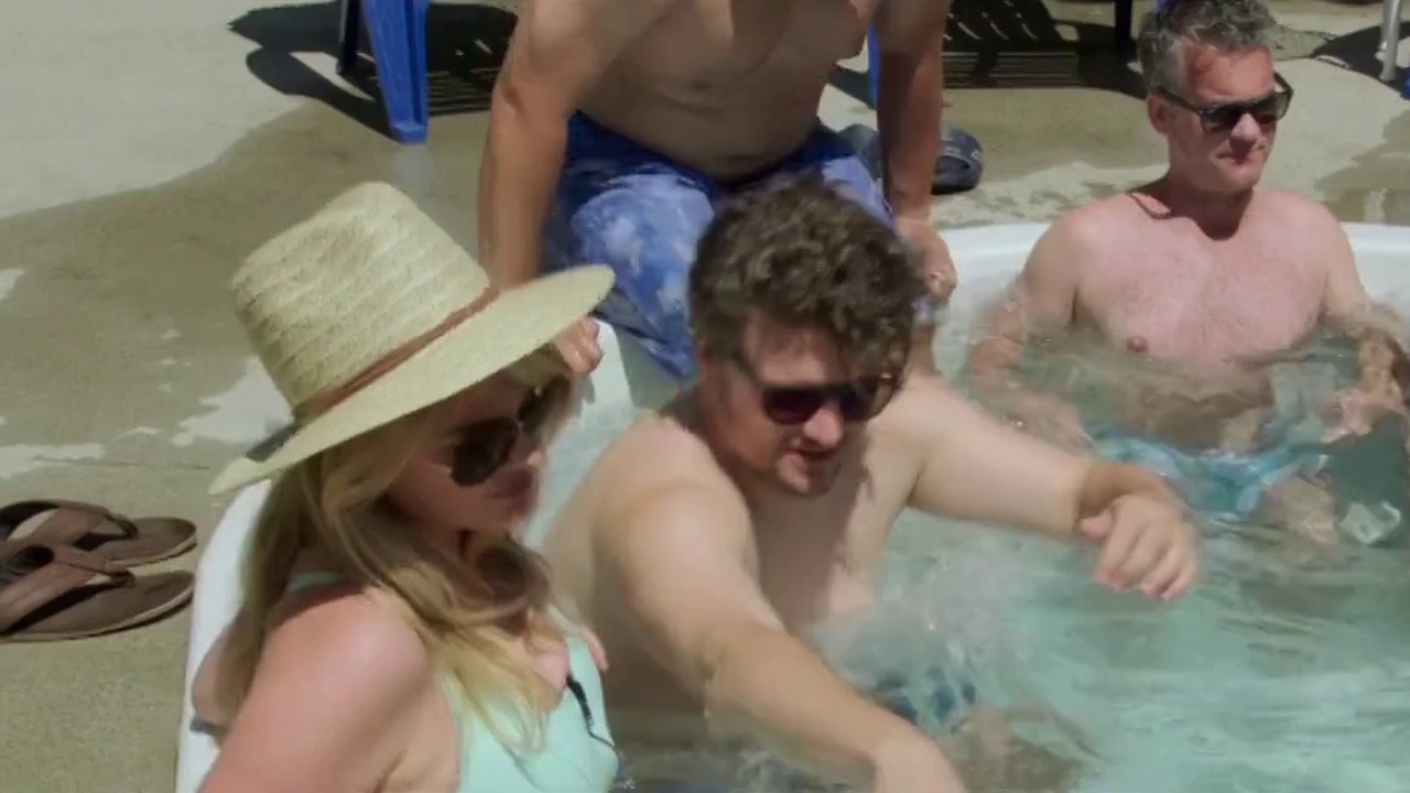 Kate Upton as Meg in the hot tub at the pool in The Layover (2017)