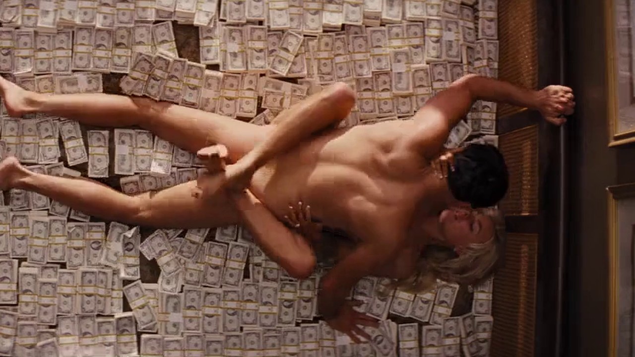 Margot Robbie as Naomi Lapaglia, naked on a bed of cash with Leonardo DiCaprio, The Wolf of Wall Street (2013)