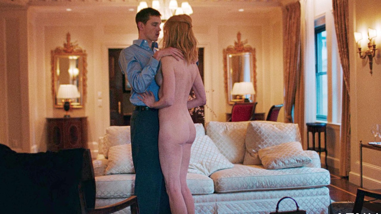 Nicole Kidman and Harris Dickinson standing by the sofa, Babygirl