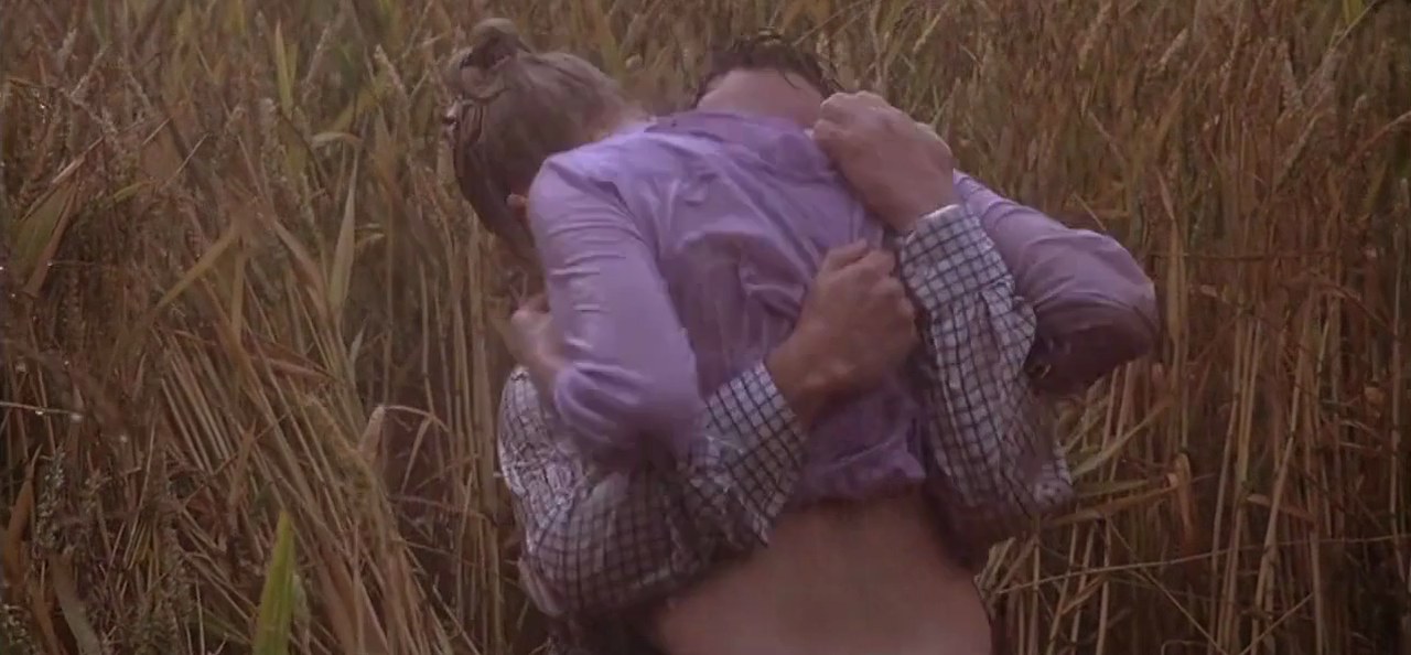 Nola and Chris in the rain-soaked field, Match Point