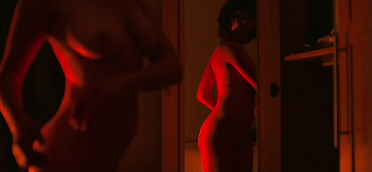 Scarlett Johansson turning in front of the mirror, Under the Skin