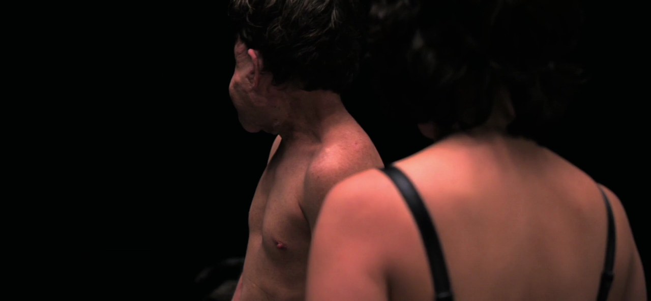 Scarlett Johansson and Adam Pearson in the black room, Under the Skin (2013)