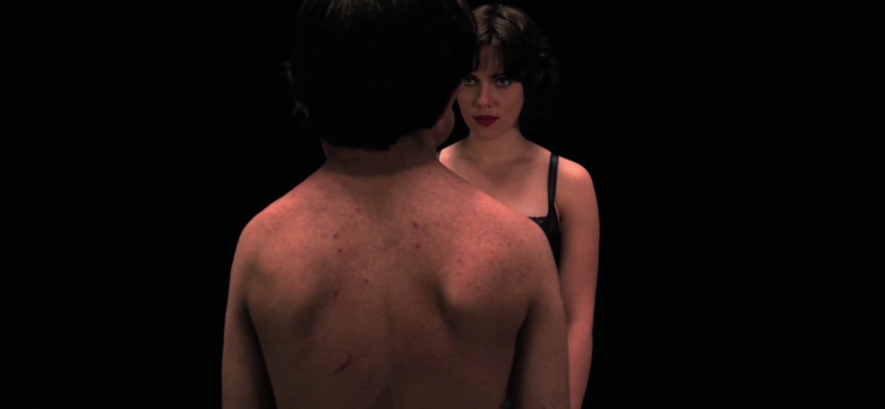 Adam Pearson and Scarlett Johansson in the black room, Under the Skin (2013)