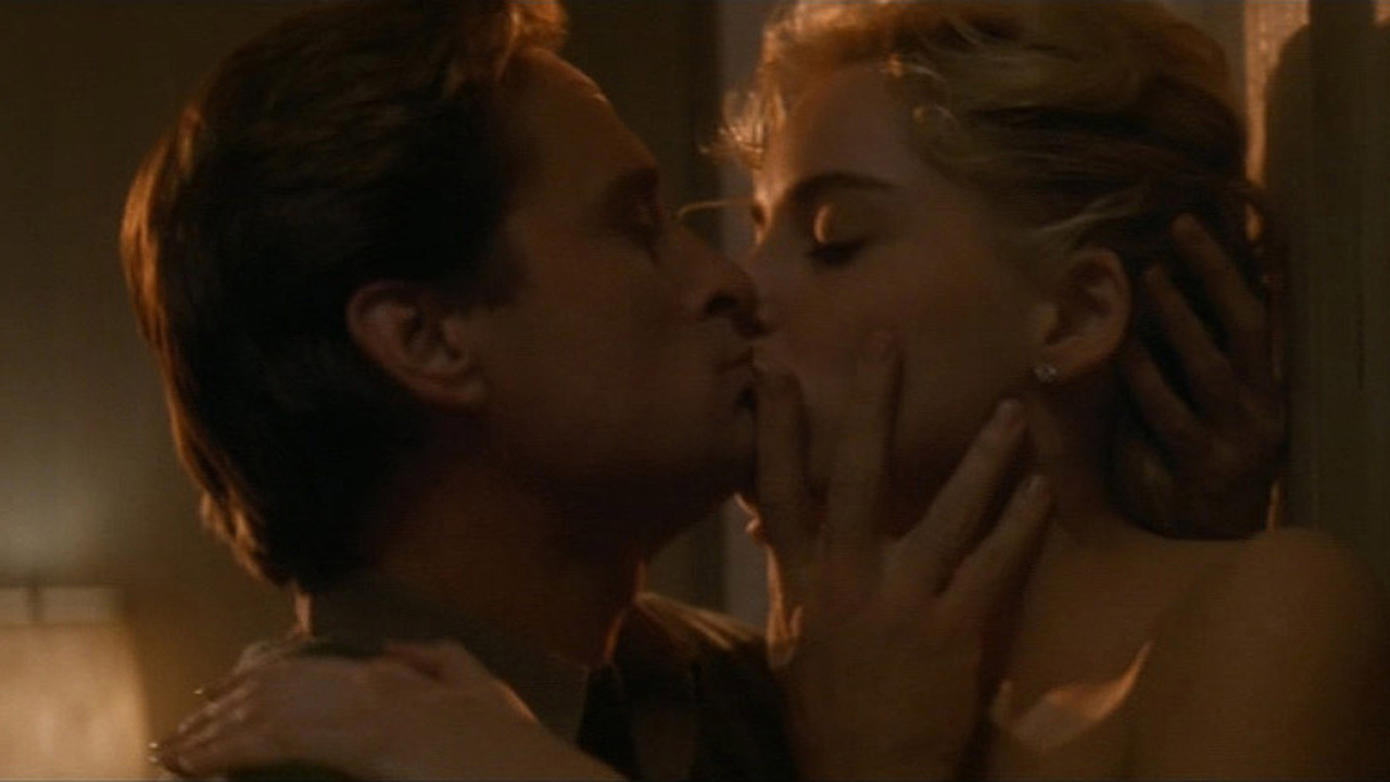 Sharon Stone as Catherine Tramell kissing Michael Douglas as Nick Curran in Basic Instinct (1992)