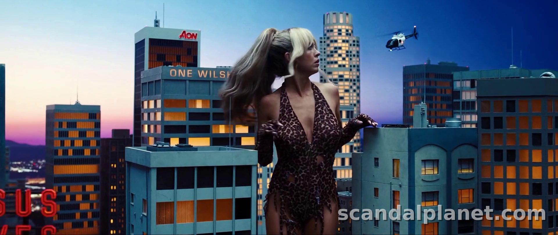 Giant Cassie in leopard print towering over miniature Los Angeles, Euphoria S3E5