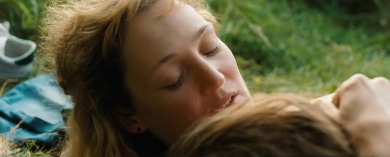 Vicky Krieps as Lucy lying in the grass, Gutland (2017)