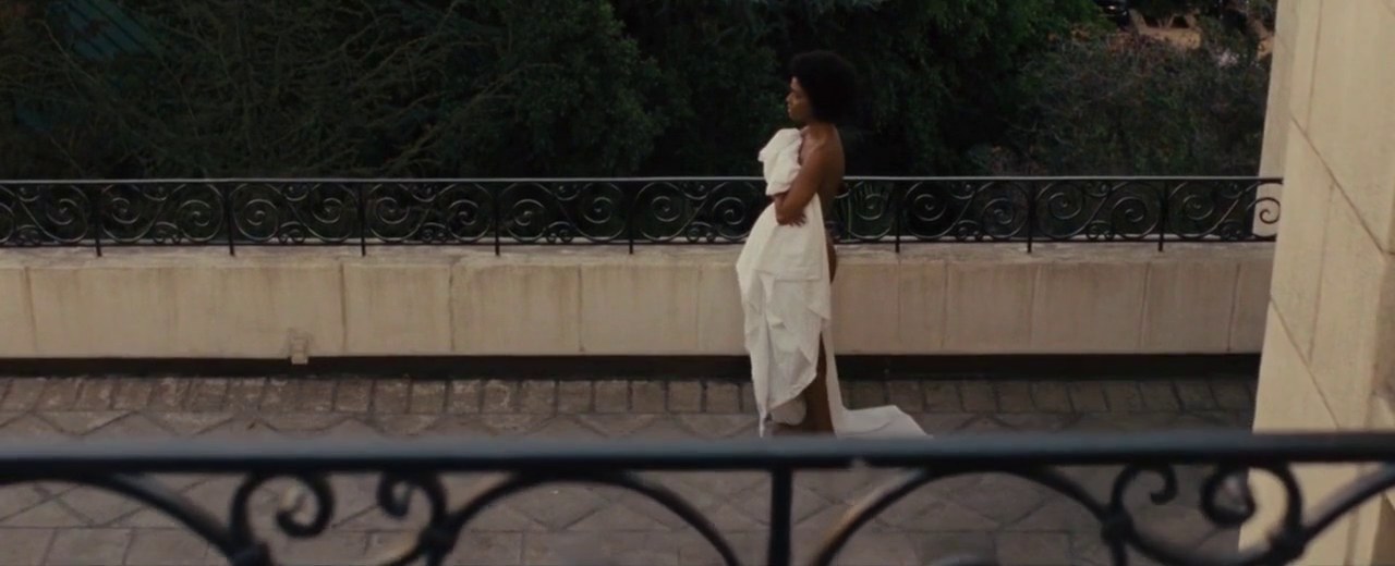 Zoe Saldana in the white dress, Nina