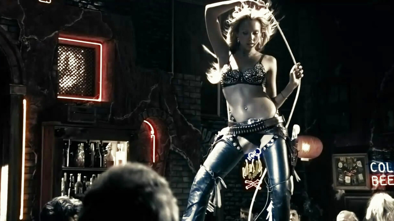 Jessica Alba as Nancy Callahan dancing in lingerie and chaps in Sin City (2005)