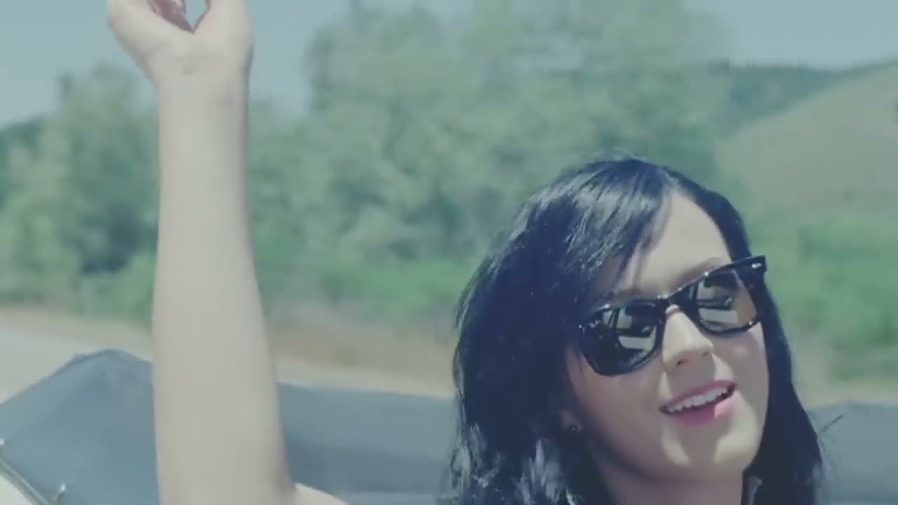 Katy Perry in sunglasses riding in the convertible in the Teenage Dream video (2010)