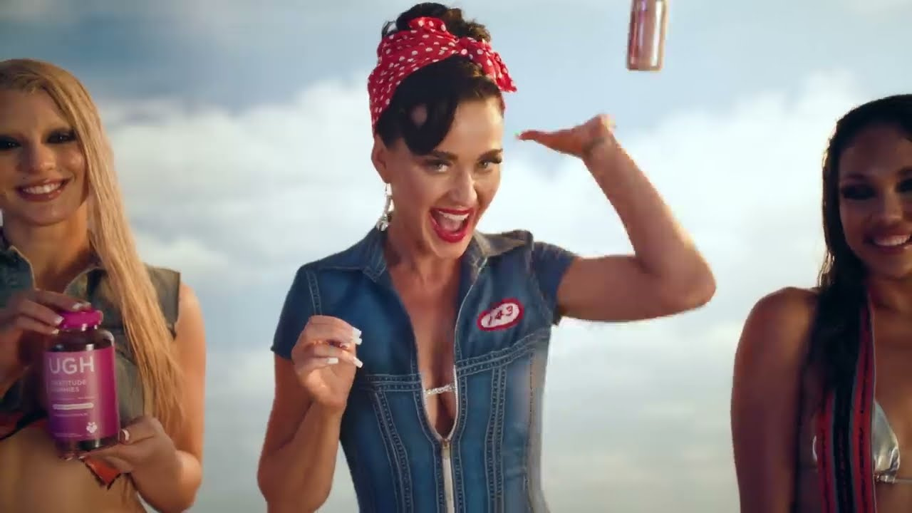 Katy Perry in a denim work shirt with the other workers in the Woman's World video (2024)