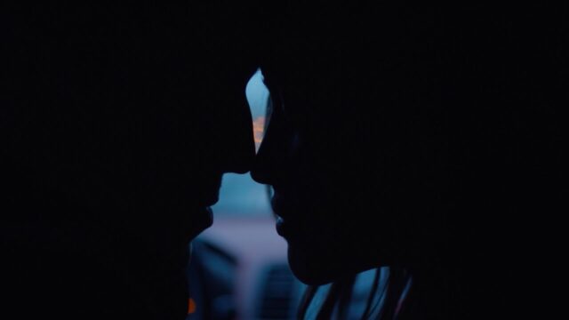 Sarah Stephens in profile, about to kiss, in Lauv’s official video for The Other