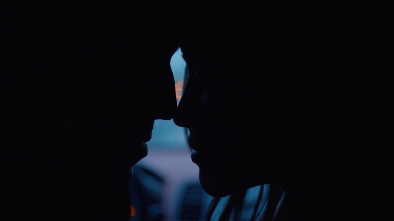Sarah Stephens in profile, about to kiss, in Lauv’s official video for The Other
